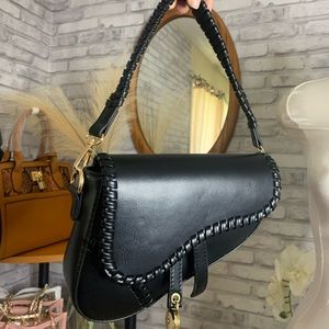 Black saddle bag (comes with a strap)